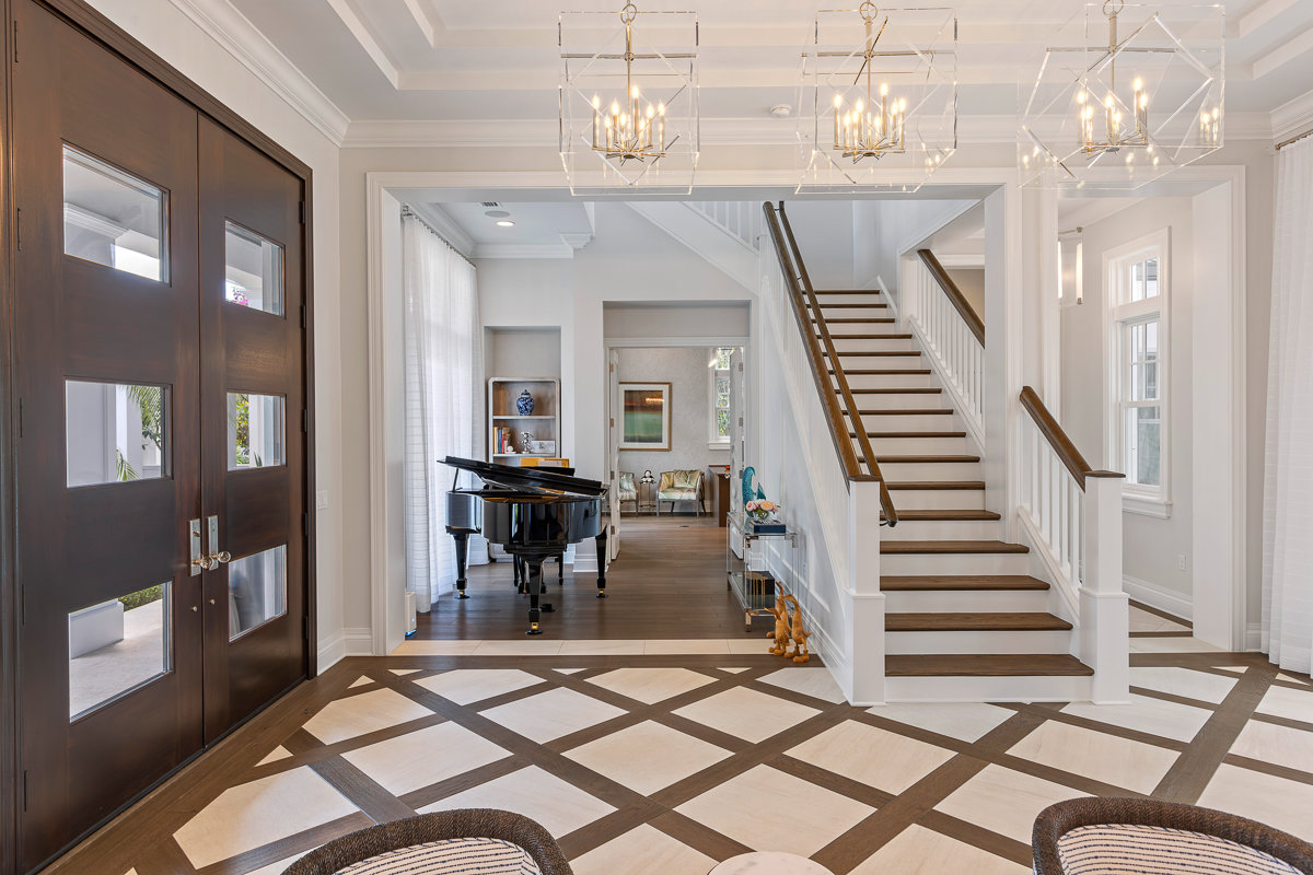 inside home with brown french doors and stairs